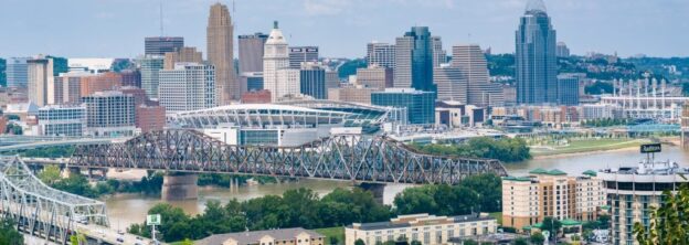 City skyline with river, bridges, stadium